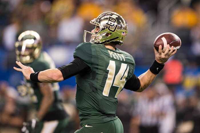 Jan 1, 2015; Arlington, TX, USA; Baylor Bears quarterback Bryce Petty (14) passes against the Michigan State Spartans in the 2015 Cotton Bowl Classic at AT&T Stadium. The Spartans defeated the Bears 42-41. Mandatory Credit: Jerome Miron-USA TODAY Sports